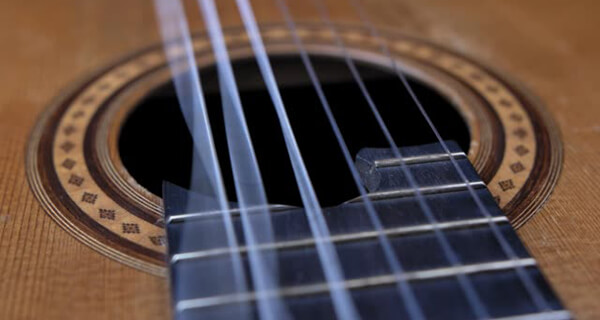 Vibrations of the Guitar Strings